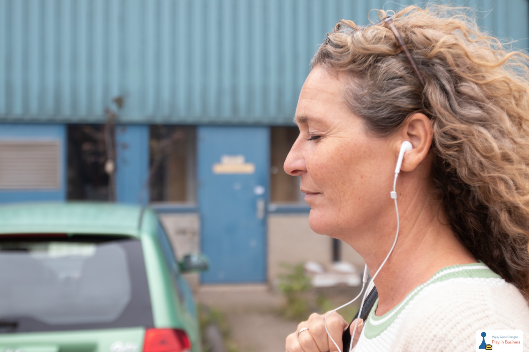 A woman listening, eyes closed
